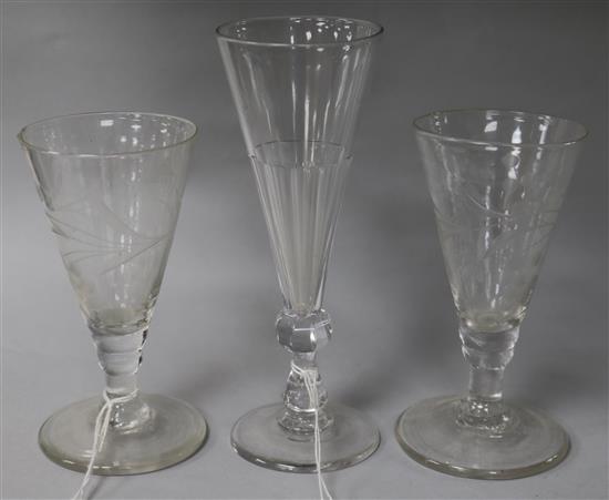 A pair of engraved ale glasses and a taller glass	 13cm, 16.5cm